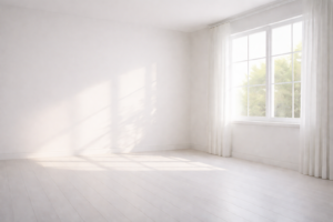 自然光が差し込む白い部屋。窓の影が床と壁に静かに伸び、視界を休ませる余白のある空間。